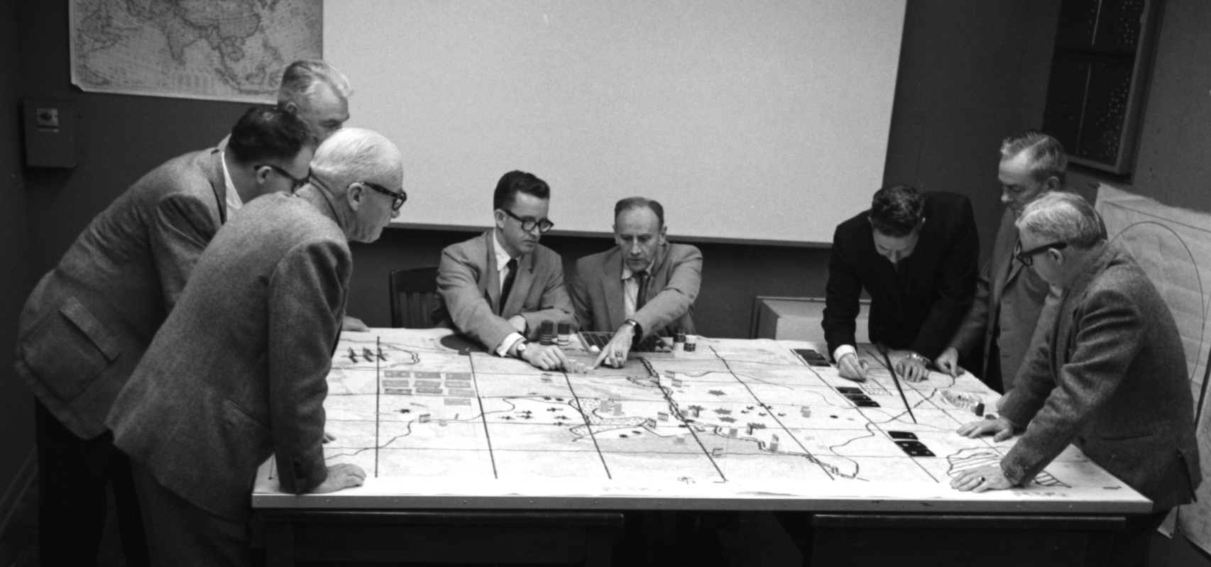 Engineering Operations game with Milton Weiner, Olaf Helmer, and others, 1966. RAND Archives.